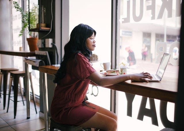 business woman on her computer at a coffee shop